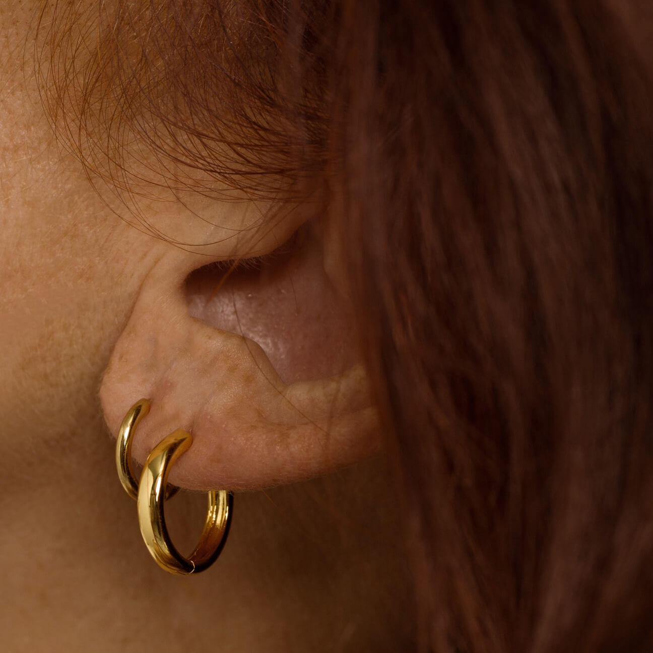 Bold Hoops in Titanium (Gold) on model